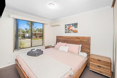 Postel nebo postele na pokoji v ubytování Alice Village