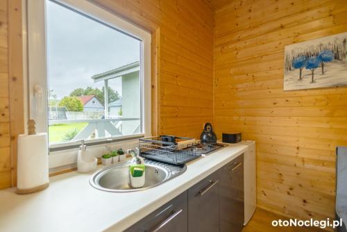 Kuchyň nebo kuchyňský kout v ubytování MożeMorze? Ośrodek Domków Letniskowych