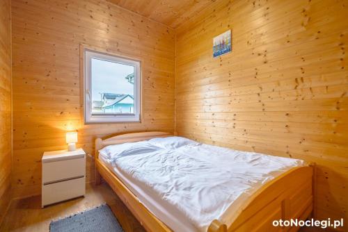 Postel nebo postele na pokoji v ubytování MożeMorze? Ośrodek Domków Letniskowych
