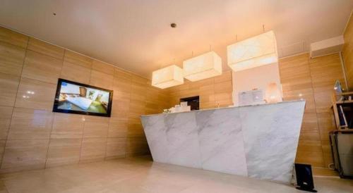 a room with a flat screen tv on a wall at Hotel One Byeonsan in Chungmak-tong