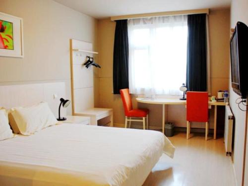 Posteľ alebo postele v izbe v ubytovaní Jingjiang Inn Zhengzhou Zhengbian Road