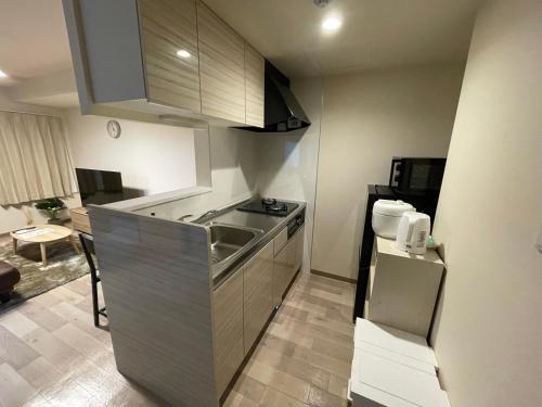 Η κουζίνα ή μικρή κουζίνα στο ホロムア澄川