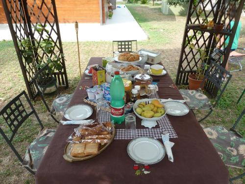a picnic table with food and drinks on it at 'O Chalet in Pozzuoli