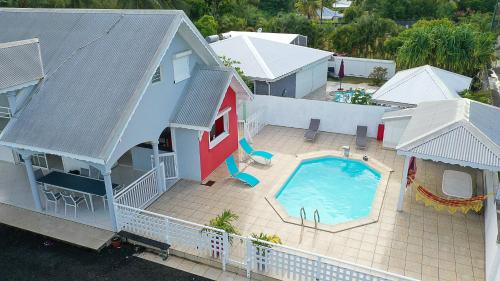 an aerial view of a house with a swimming pool at NAHEFLEURS in Sainte-Anne