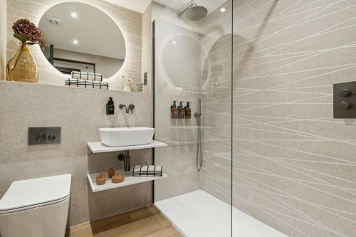 a bathroom with a sink and a shower at 2BR West End Apartment Near Botanic Gardens in Glasgow
