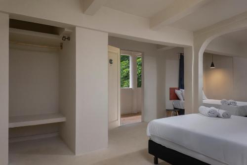 Ένα ή περισσότερα κρεβάτια σε δωμάτιο στο MK BEACH Playa Del Carmen