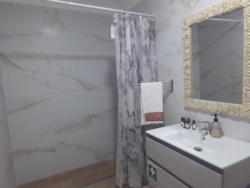 a bathroom with a sink and a mirror at Casas da Lameirancha in Mação