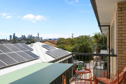a balcony with solar panels on the roof of a house at Pine Street Apartments Bulimba in Brisbane