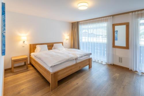 Ένα ή περισσότερα κρεβάτια σε δωμάτιο στο Center peak apartment Zermatt