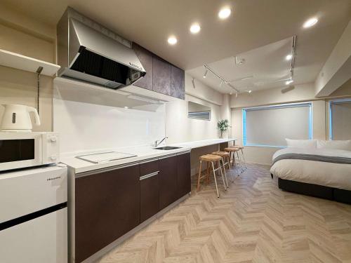 Η κουζίνα ή μικρή κουζίνα στο Clio Matoba by b hotel - Fully Equipped Studio 10min to Hiroshima Station