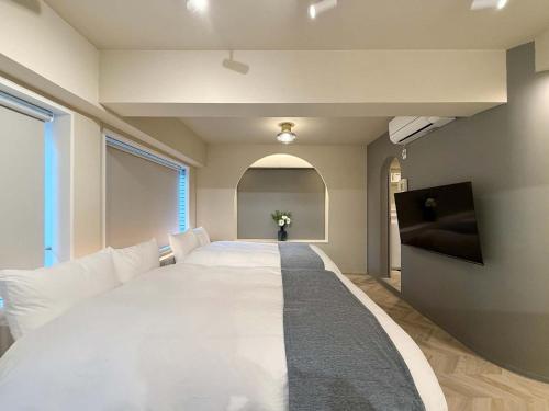 Μια τηλεόραση ή/και κέντρο ψυχαγωγίας στο Clio Matoba by b hotel - Fully Equipped Studio 10min to Hiroshima Station