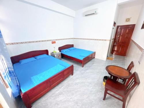 Cama o camas de una habitación en nhà nghỉ thanh thuy 2