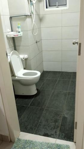 a bathroom with a toilet and a shower at Canopy Hill Kajang 2 in Kajang
