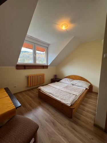 Postel nebo postele na pokoji v ubytování Zajazd Oleńka