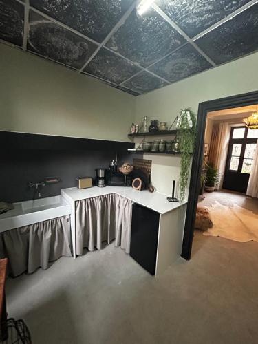 a kitchen with a table in a room at Dreamhome B&B Limoux in Limoux