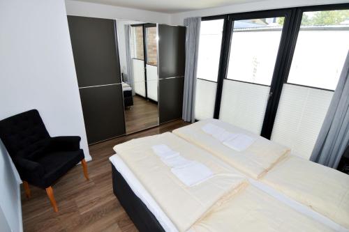 Postel nebo postele na pokoji v ubytování Fischerdorf No 26