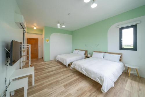 Postel nebo postele na pokoji v ubytování Tian Che Tian Yuan