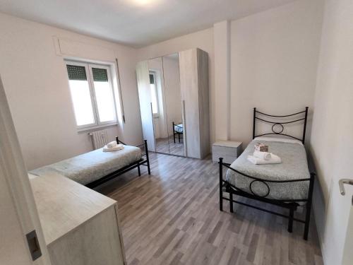 Postel nebo postele na pokoji v ubytování Trilocale Via Veneto - F&L Apartment