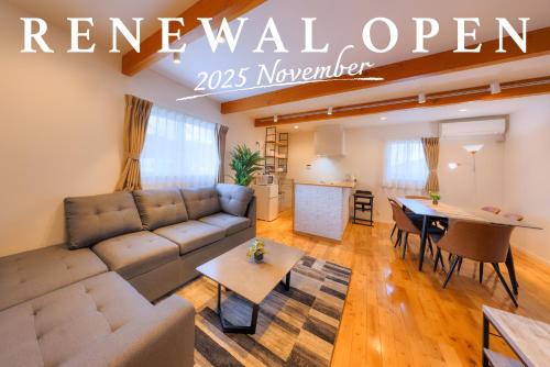 a living room with a couch and a table at Villas Waraku in Fujiyoshida