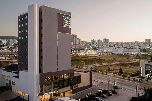 a building with a sign on the side of it at AC Hotel by Marriott San Luis Potosi in San Luis Potosí