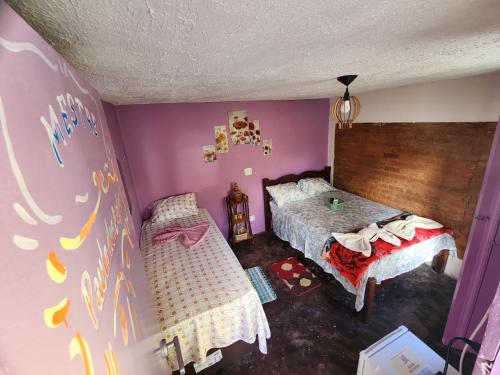 Postel nebo postele na pokoji v ubytování Casa Bantu - Vila Rosa