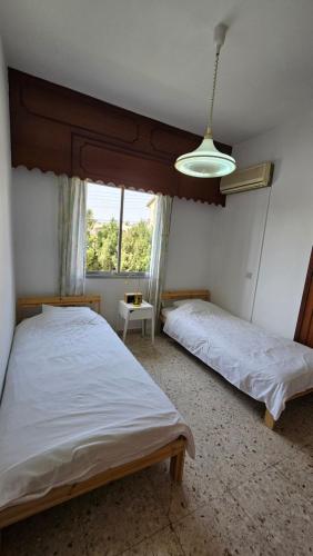 Postel nebo postele na pokoji v ubytování Family Nest In The Heart Of Limassol