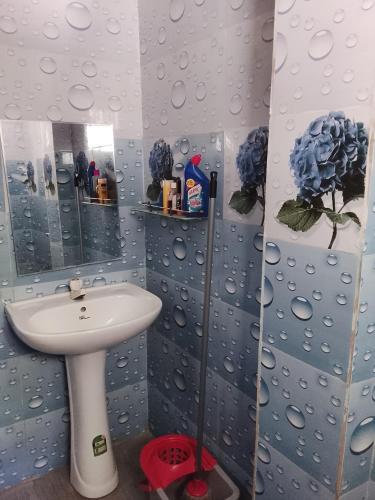 a bathroom with a sink and a mirror at Sana Studio in Weligama