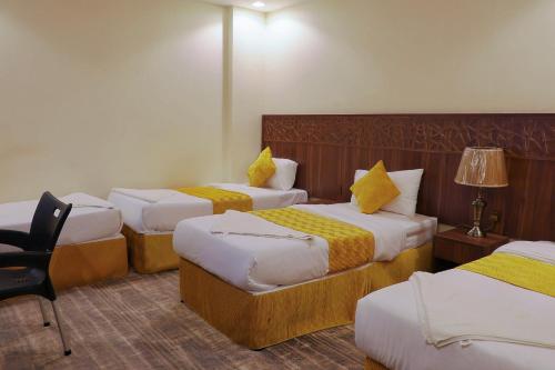 Postel nebo postele na pokoji v ubytování فندق بسمة الوحدة