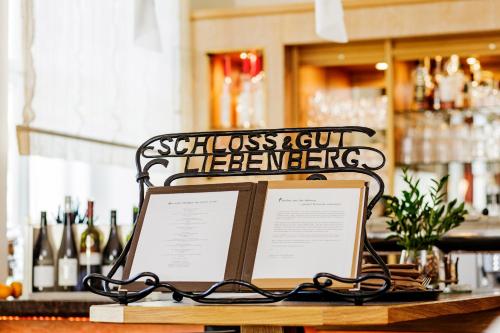a sign sitting on a table in a bar at Schloss und Gut Liebenberg in Liebenberg