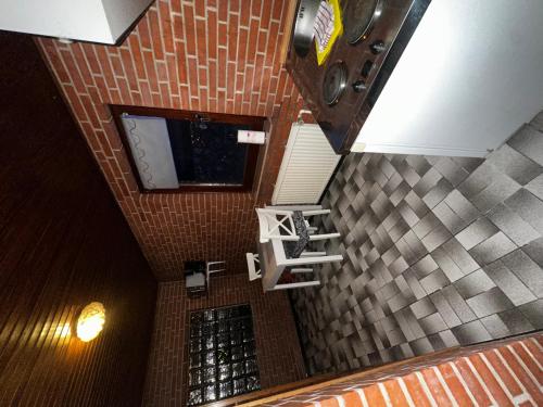 an overhead view of a bathroom with a tile wall at Schöne Monteurs Wohnung 6 in Wesseln