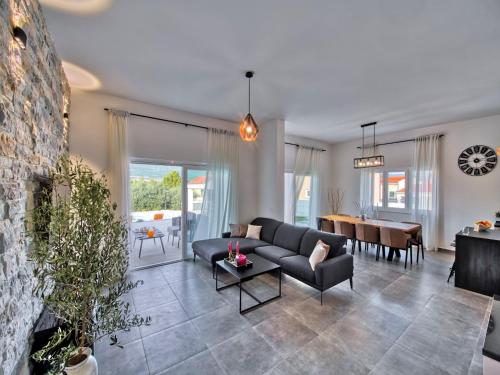 a living room with a couch and a table at Villa in Pridraga with Pool near the Sea in Pridraga