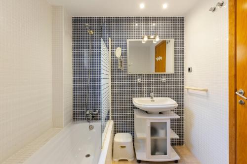 a bathroom with a sink and a toilet and a shower at Beachfront penthouse in La Manga in San Blas