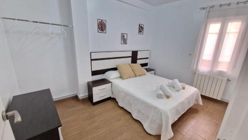 Giường trong phòng chung tại El Madroño Cazorla