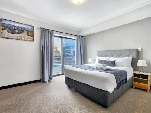 Ένα ή περισσότερα κρεβάτια σε δωμάτιο στο 906 Icon Luxury Apartments