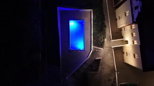 an overhead view of a blue door in a building at Vila Băncii 1888 by SunGarden in Băile Herculane