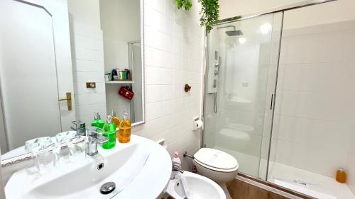 a bathroom with a sink and a shower and a toilet at Bellaria Portofino in Rapallo
