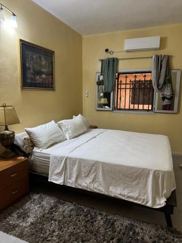 Ένα ή περισσότερα κρεβάτια σε δωμάτιο στο Ô bien être