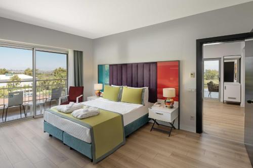 Ένα ή περισσότερα κρεβάτια σε δωμάτιο στο Marvida Family Eco - Ultra All Inclusive & Kids Concept