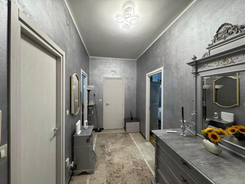 a bathroom with a sink and a mirror at Casa di Dome in Turin