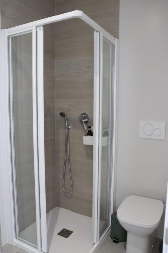 a shower in a bathroom with a toilet at La Herrada Home in Los Montesinos