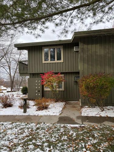 a green house with snow on the ground at Shanty Creek, Condo, Golf ,Sleeps 4, Pets welcome! in Bellaire