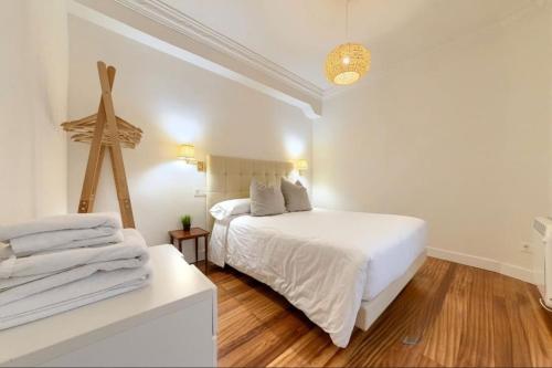 Ένα ή περισσότερα κρεβάτια σε δωμάτιο στο Cozy Apartamento