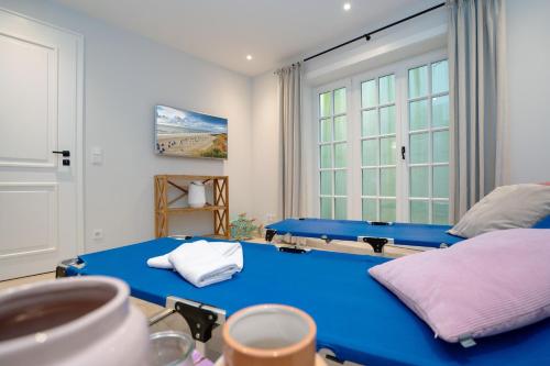 Postel nebo postele na pokoji v ubytování Haus Carstensen Nord