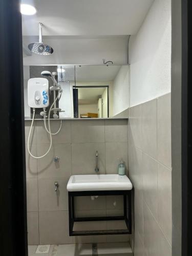 a bathroom with a sink and a mirror at PCB The Seven Gardens Resort & Spa in Kota Bharu