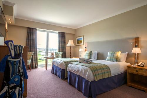En eller flere senge i et værelse på Carnoustie Golf Hotel 'A Bespoke Hotel’