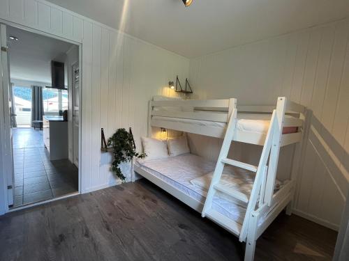 a room with two bunk beds and a ladder at Åre Stay- Åregårdarna 426 in Åre