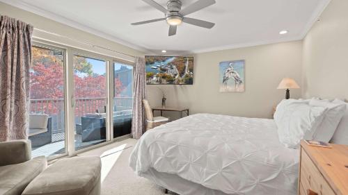 a bedroom with a bed and a large window at Lakeside Haven - Condo for 8 in Sunrise Beach