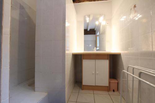 a bathroom with a sink and a mirror at Le lheze in Cette-Eygun