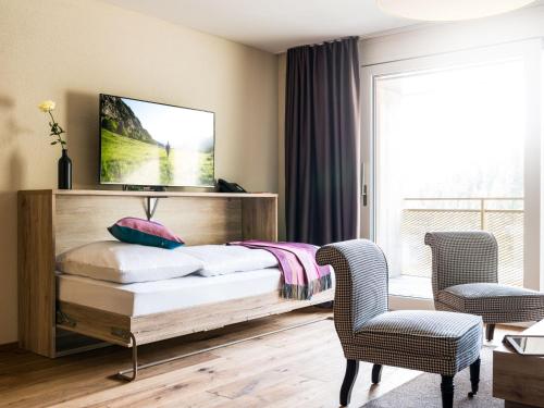 Postel nebo postele na pokoji v ubytování Apartment Peaks Place Apartment-Hotel & Spa-5 by Interhome