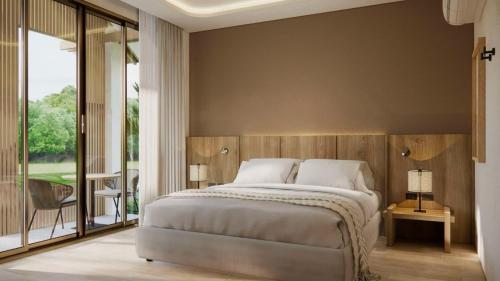 a bedroom with a large bed and a large window at Phi Phi Andaman Legacy Resort in Phi Phi Don